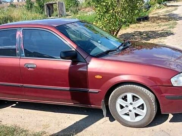 Авто Mazda 323 1999 № 7868276