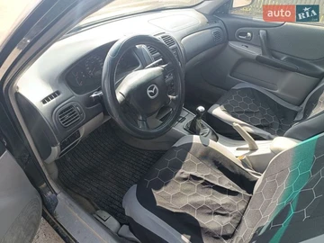 Авто Mazda 323 2000 № 8644622