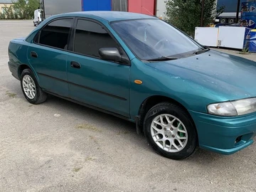 Авто Mazda 323 1997 № 7960684