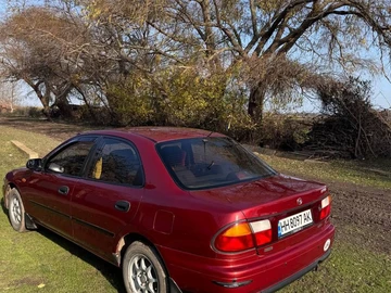 Авто Mazda 323 1997 № 8284197