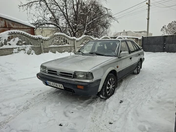 Авто Nissan Bluebird 1990 № 8404409