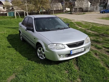 Авто Mazda 323 1998 № 8684783