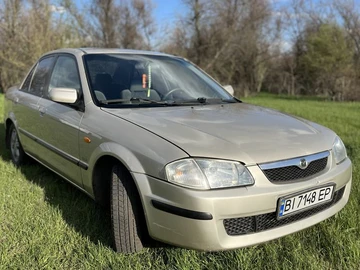 Авто Mazda 323 1998 № 8744341