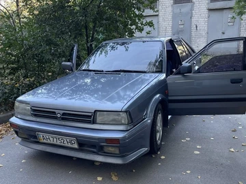 Авто Nissan Bluebird 1990 № 8751605