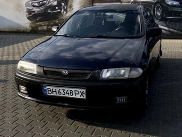 Авто Mazda 323 1997 № 8836599