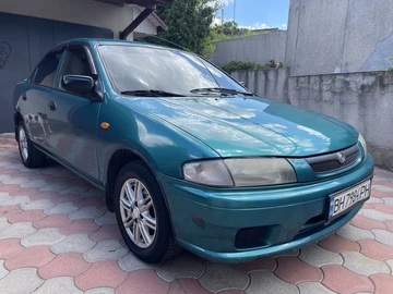 Авто Mazda 323 1998 № 8866189