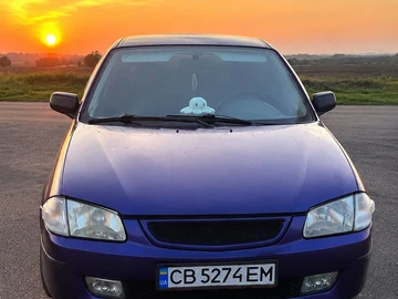 Авто Mazda 323 1999 № 8907399