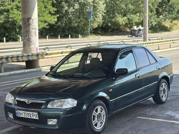 Авто Mazda 323 1998 № 8963458