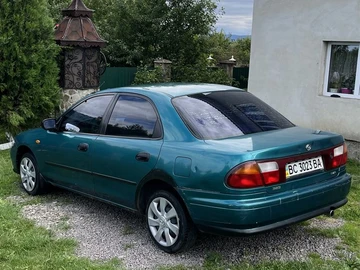 Авто Mazda 323 1997 № 8974063